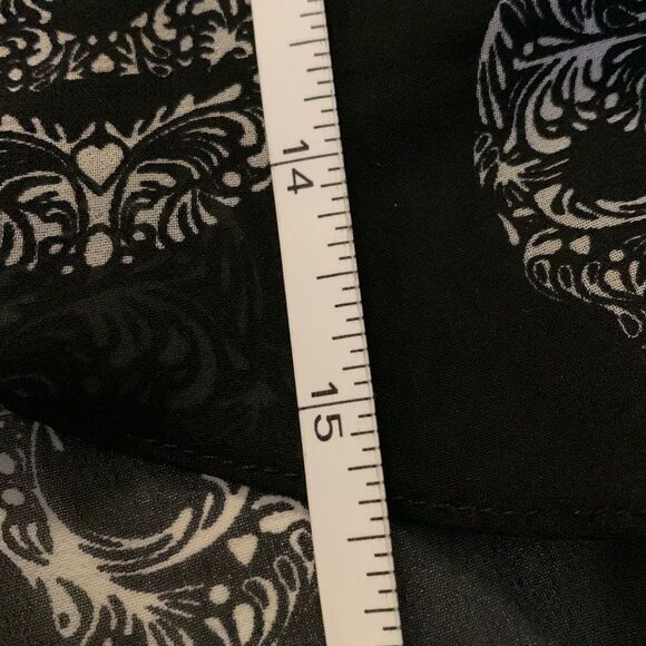 H&m black sugar skull hi low skirt. Elastic waist size four. NWOT. - Picture 9 of 10